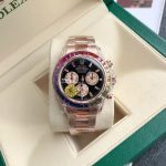 Luxury Rainbow Daytona-Style Chronograph Watch – Rose Gold Case, Multicolored Gemstone Bezel, Black Dial with Three Sub-Dials