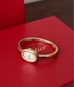 Cartier Baignoire – Women's 18K Yellow Gold Bracelet Watch with White Dial, Roman Numerals, and Blue Sapphire Crown
