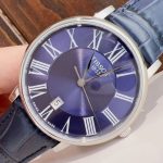 Tissot Classic Watch – Blue Dial with Roman Numerals, Navy Leather Strap, Swiss Made