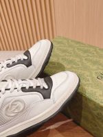 Gucci White & Black Leather Sneakers – Iconic GG Logo, Bold Contrast, Chunky Sole Design