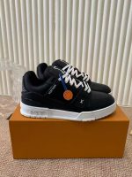 Louis Vuitton Black Leather Sneakers – Monochrome Elegance, Bold Contrast, Signature Details