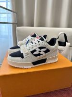 Louis Vuitton White Sneakers with Red LV Logo – Bold Statement, Iconic Design, Timeless Luxury